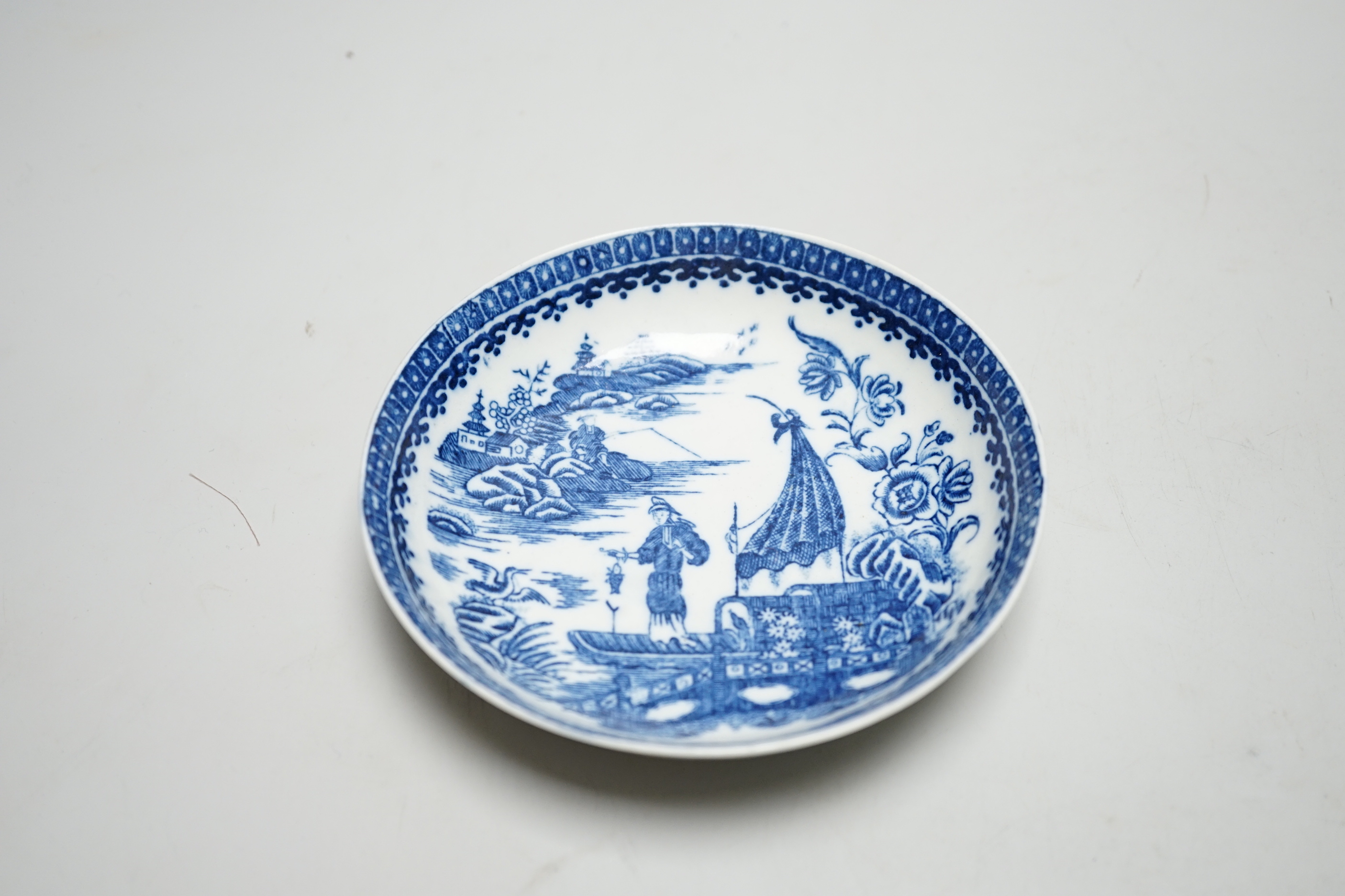 Two Worcester coffee cans, Mansfield and Three Flowers patterns, and a Worcester/Caughley coffee cup and saucer, Fisherman and Cormorant pattern